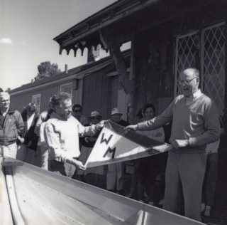 Jim Carlton and Ben Labaree hold a Williams-Mystic pennant